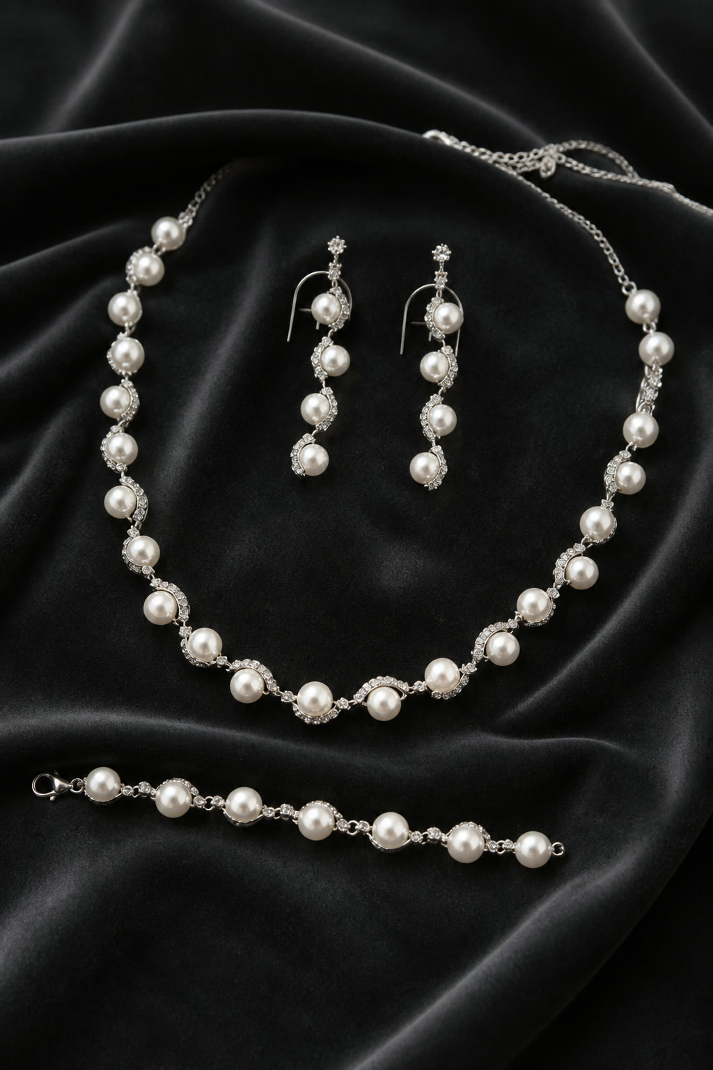 Pearl and pavé crystal wave necklace, earrings and bracelet suite